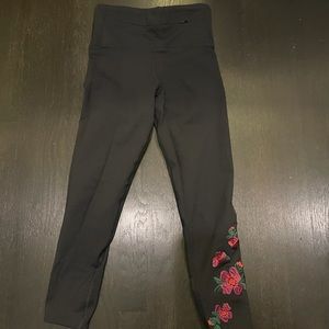 Nancy Rose black leggings with roses on the side.